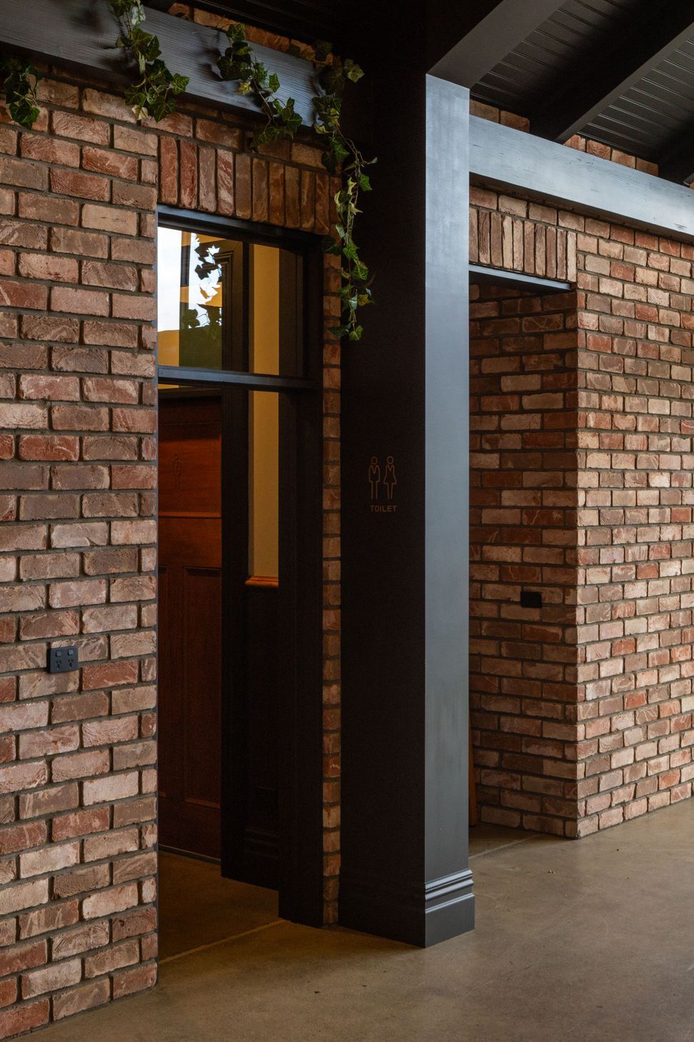 Heritage brick interior with black portal frames