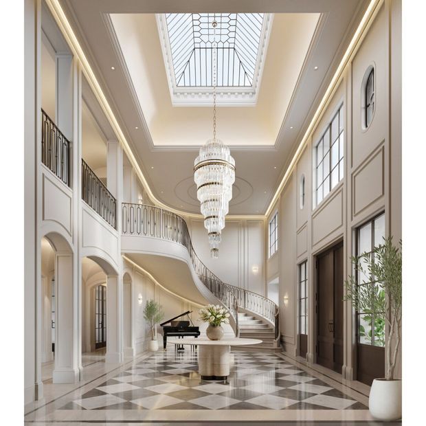 Grand, bright residential entry hall with a dramatic curved staircase and upper-level balcony, tall paneled walls, arched openings, large grid-pattern windows, a central tiered crystal chandelier, and a rectangular skylight. The polished geometric checkerboard floor and restrained cream, white, and grey palette create a refined classical atmosphere.