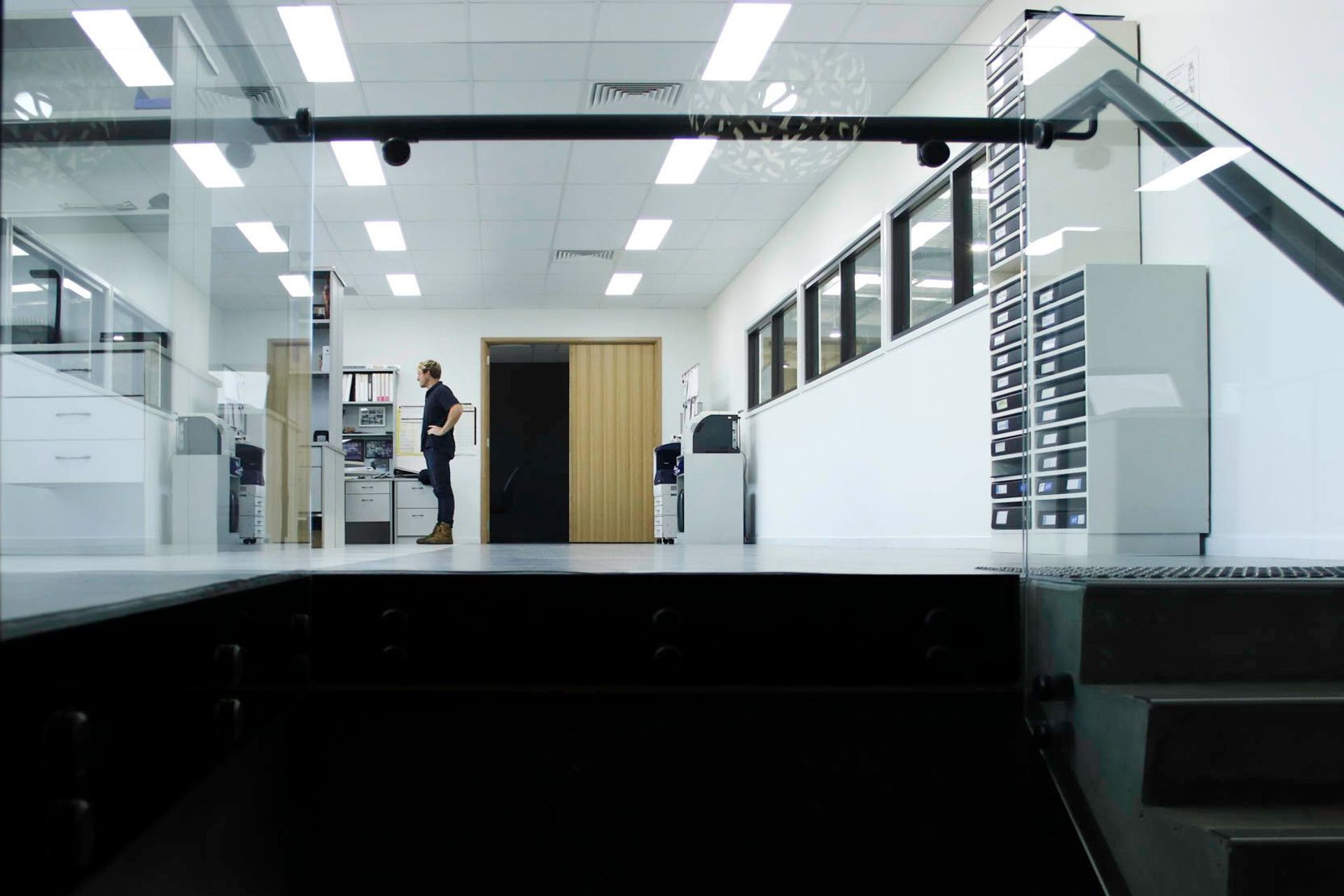 Eniquest Warehouse - Office. Mezzanine office overlooking the warehouse floor.