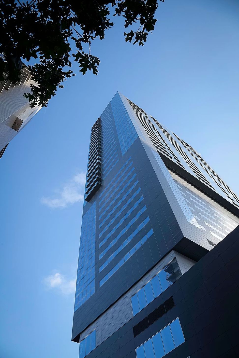 0415-Block-21-W-Austin-Andrew-Pogue-V-Exterior-West-Tower-From-Street-ap-compressed.jpg
