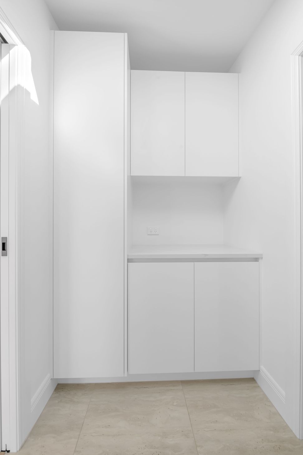 Custom cabinetry here keeps everything tucked away,  lean lines, soft-close drawers, and plenty of space without taking over the room.