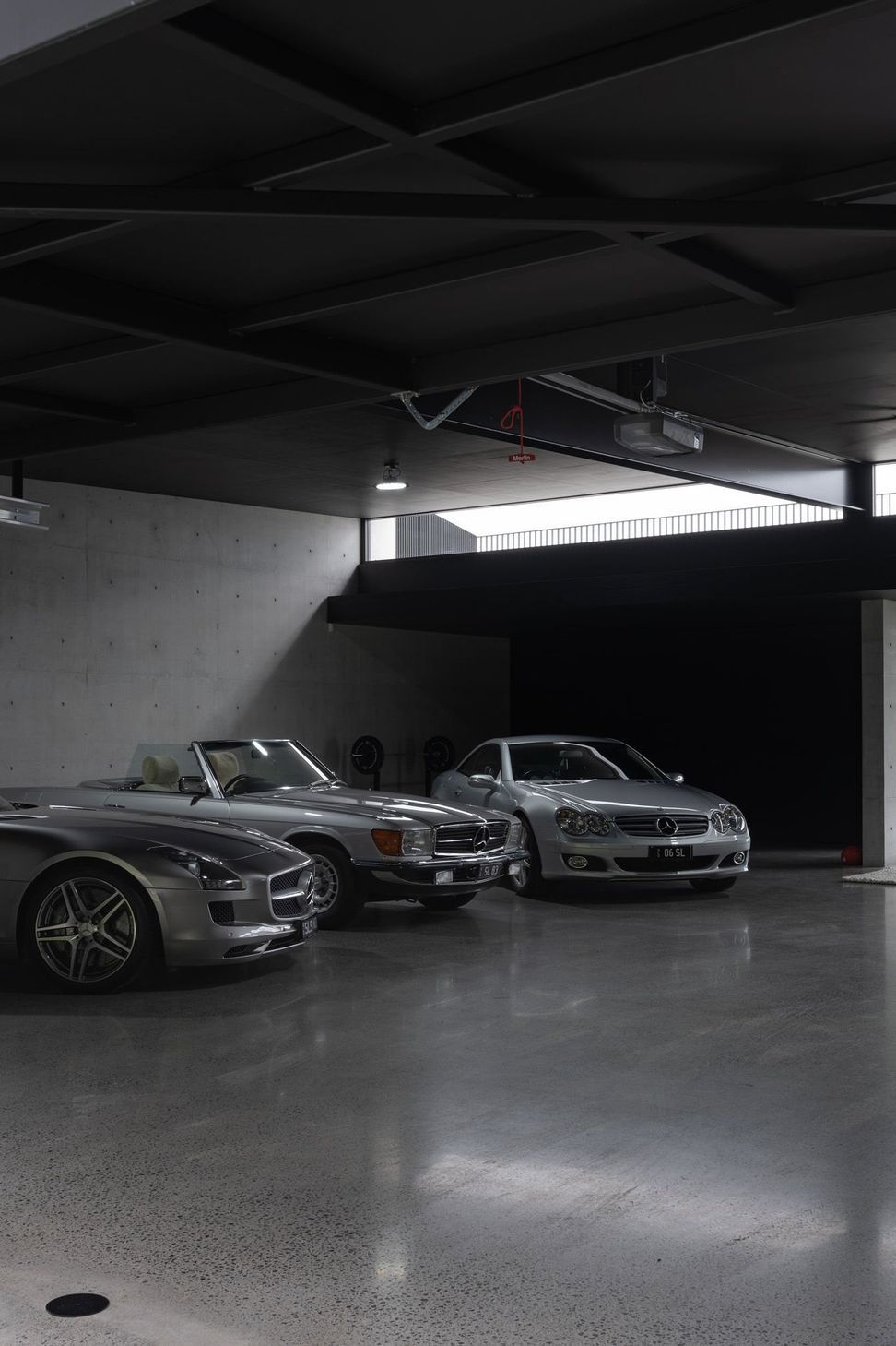 The Farm - Garage. Row of cars beneath a clerestory window.