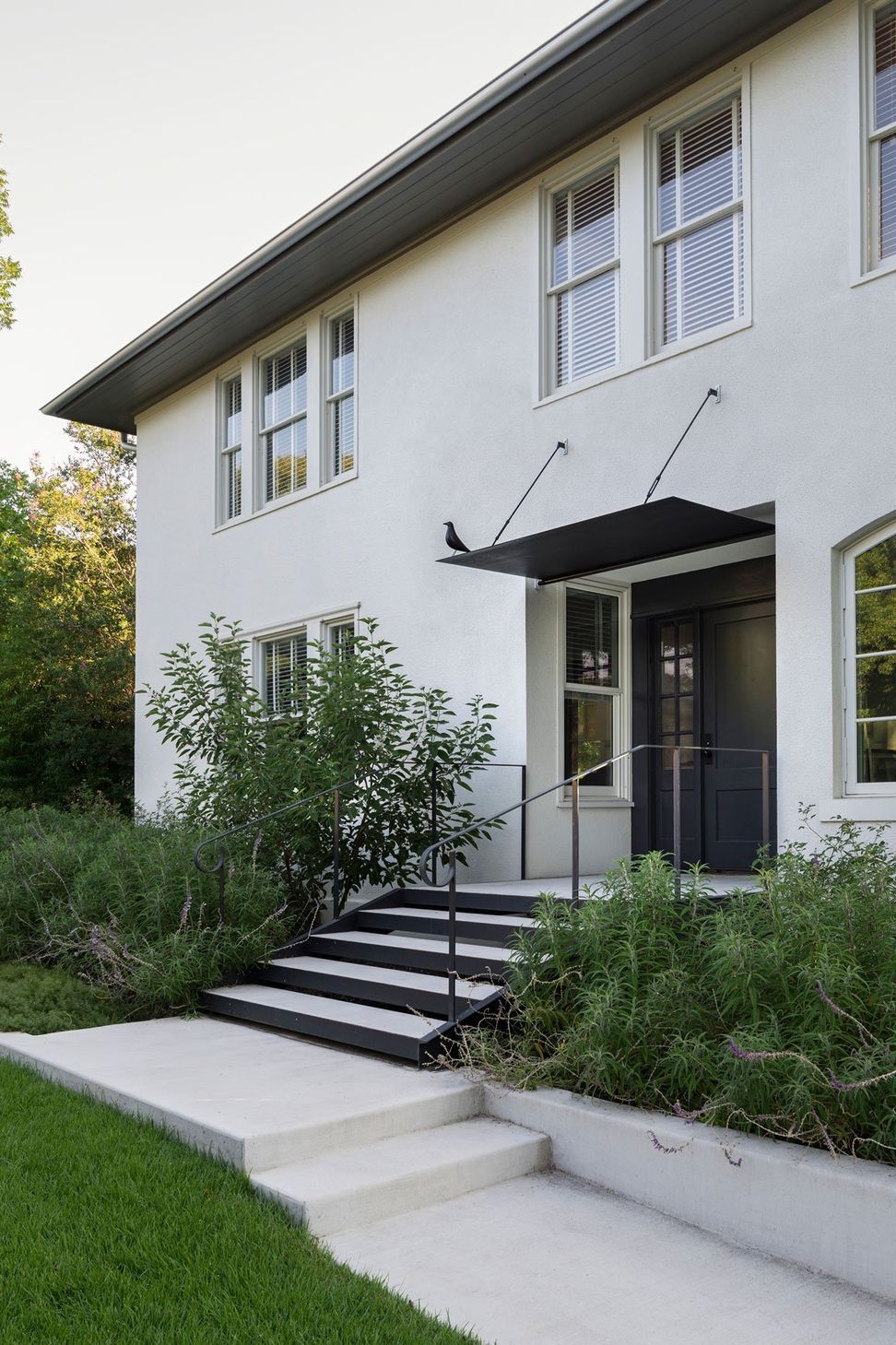 2TransformationinHemphillParkCuppettKilpatrickArchitectureandInteriorDesignaustin-tx-traditional-home-steel-canopy-front-entrance.jpg