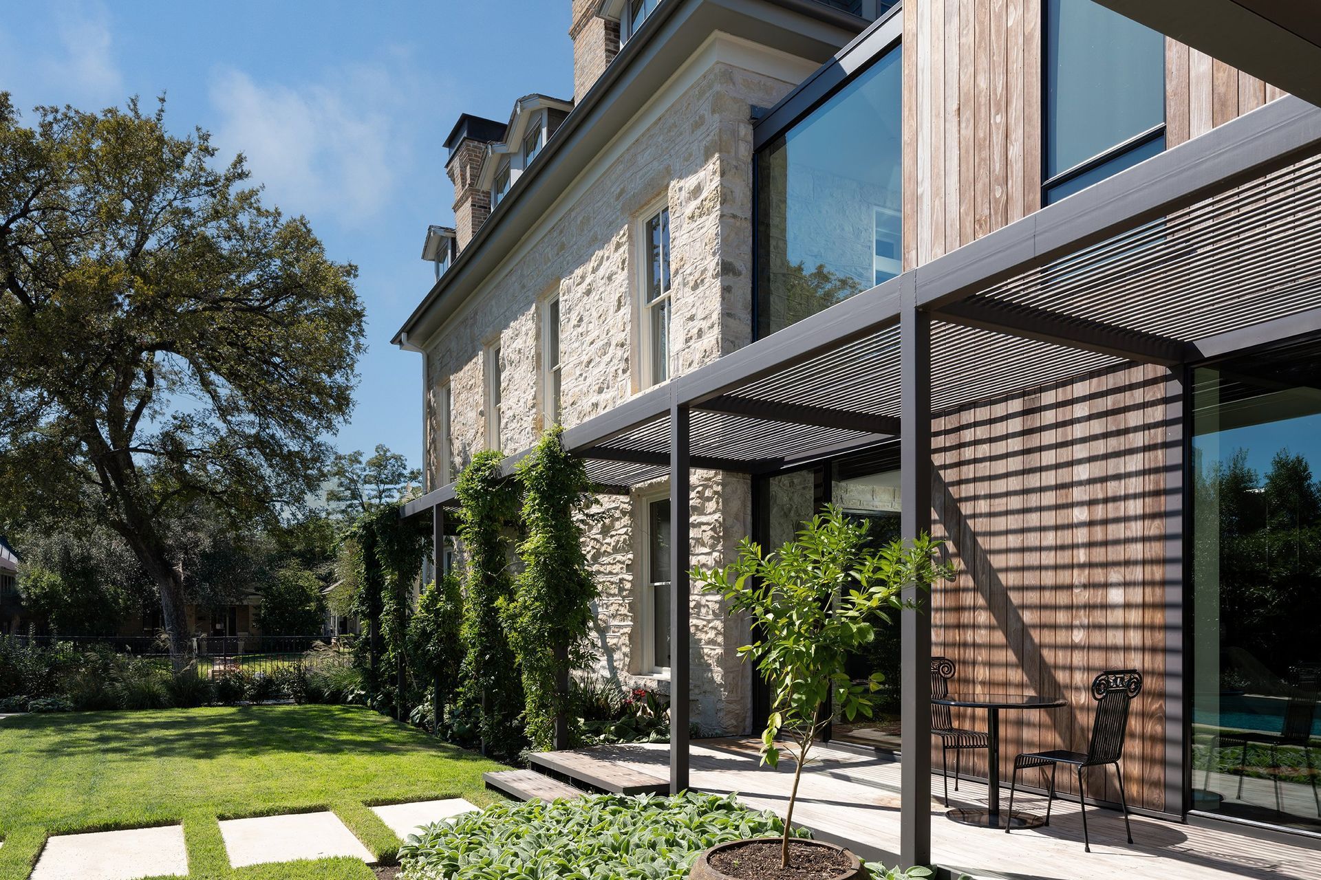 30PastandPresentPlaceCuppettKilpatrickArchitectureandInteriorDesignAustinTexasstone-secondempire-historic-addition-exterior-steel-trellis-kebony-siding-v2.jpg