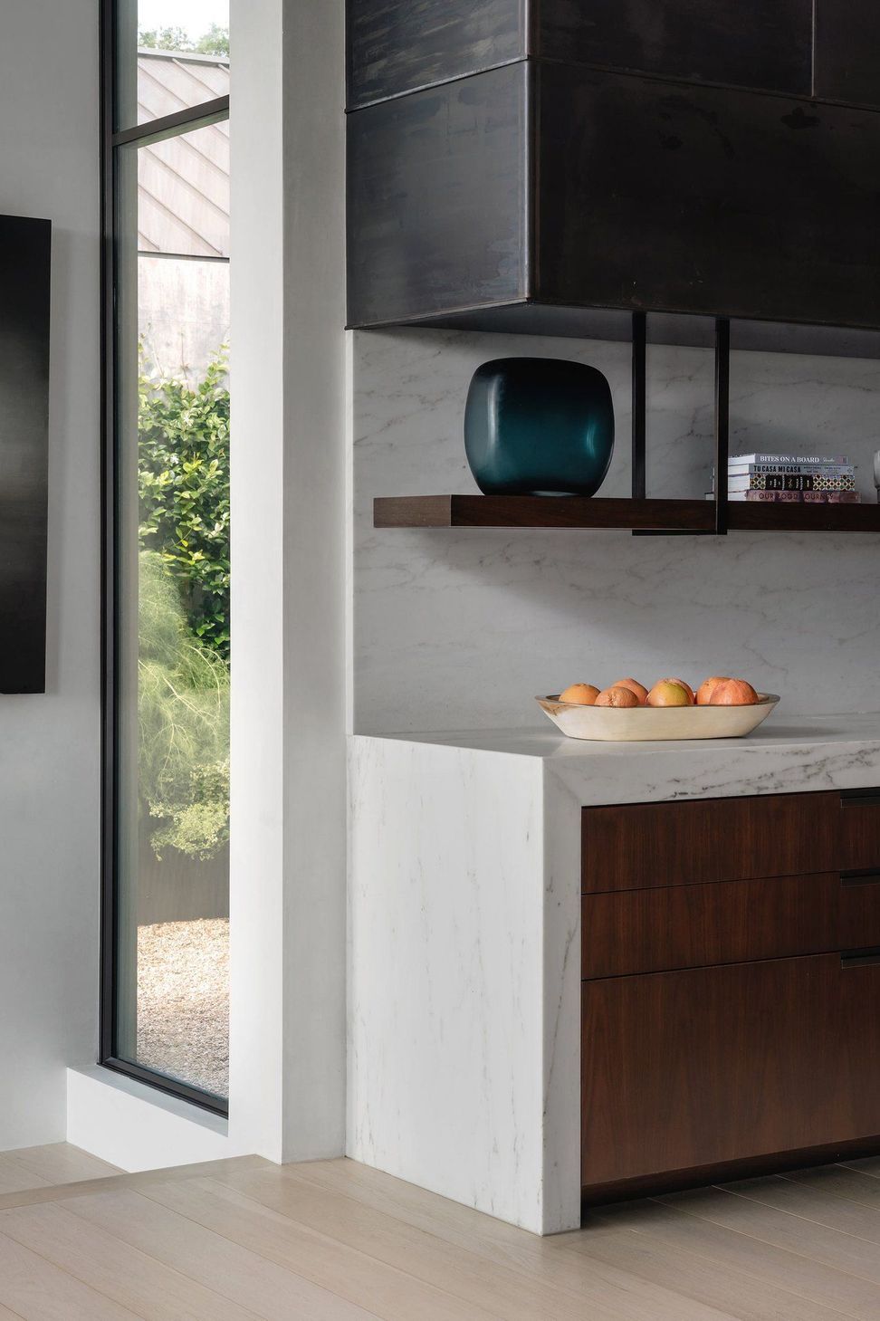 6HighontheHillCuppettKilpatrickArchitectureandInteriorDesignwhite-marble-waterfall-countertop-walnut-cabinetry-1.jpg
