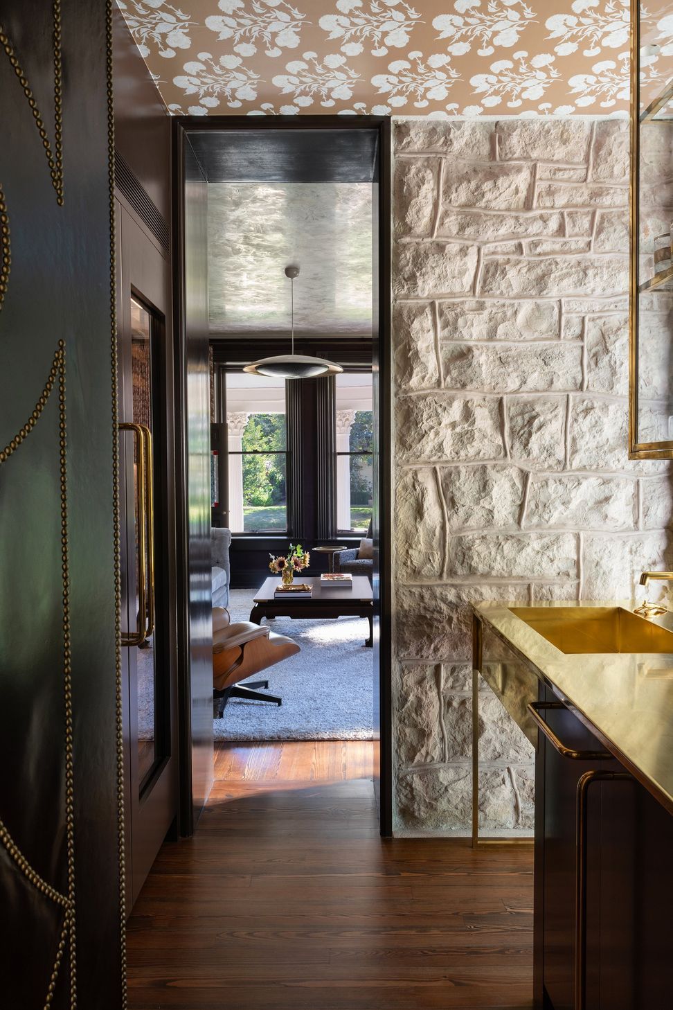 8PastandPresentPlaceCuppettKilpatrickArchitectureandInteriorDesignAustinTexasresidential-bar-leather-door-stone-wall-brass-shelves-historic.jpg