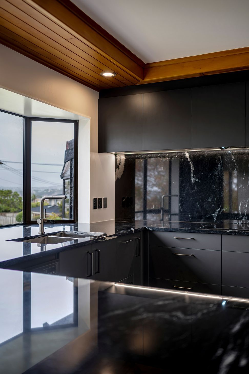 With waterfall edges and generous dimensions, this island anchors the space with quiet confidence.
