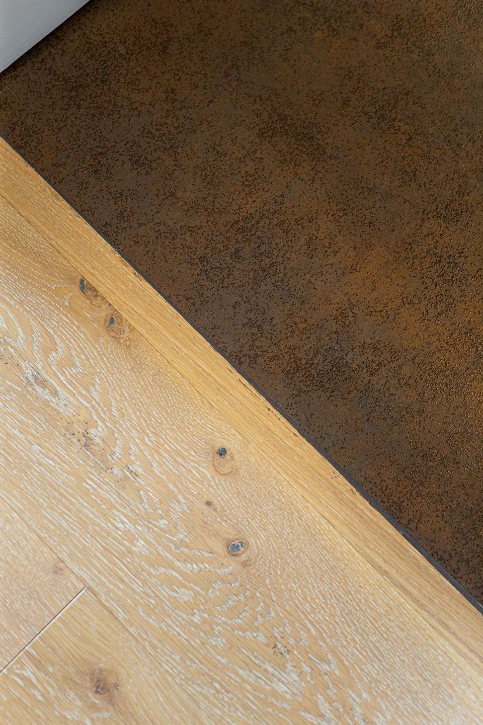 Seamless tiled floor transition to the engineered timber in the hallway.