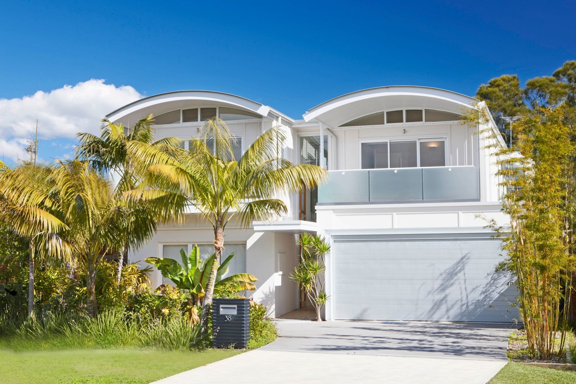 Street view showing new entry and double garage