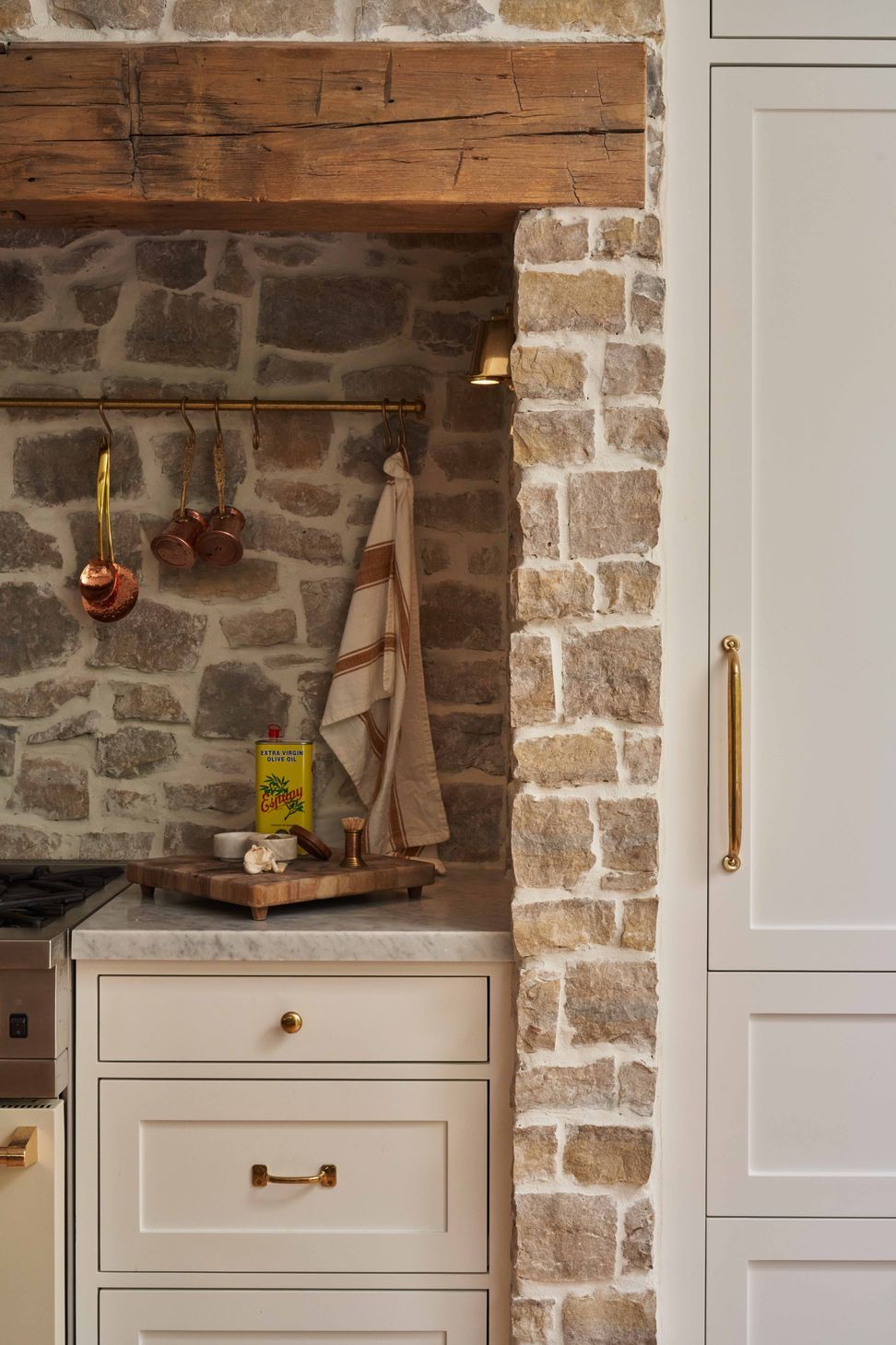 the-warren-linda-vista-english-cottage-kitchen-cobblestone-range-alcove-brass-rail-detail-13.jpg