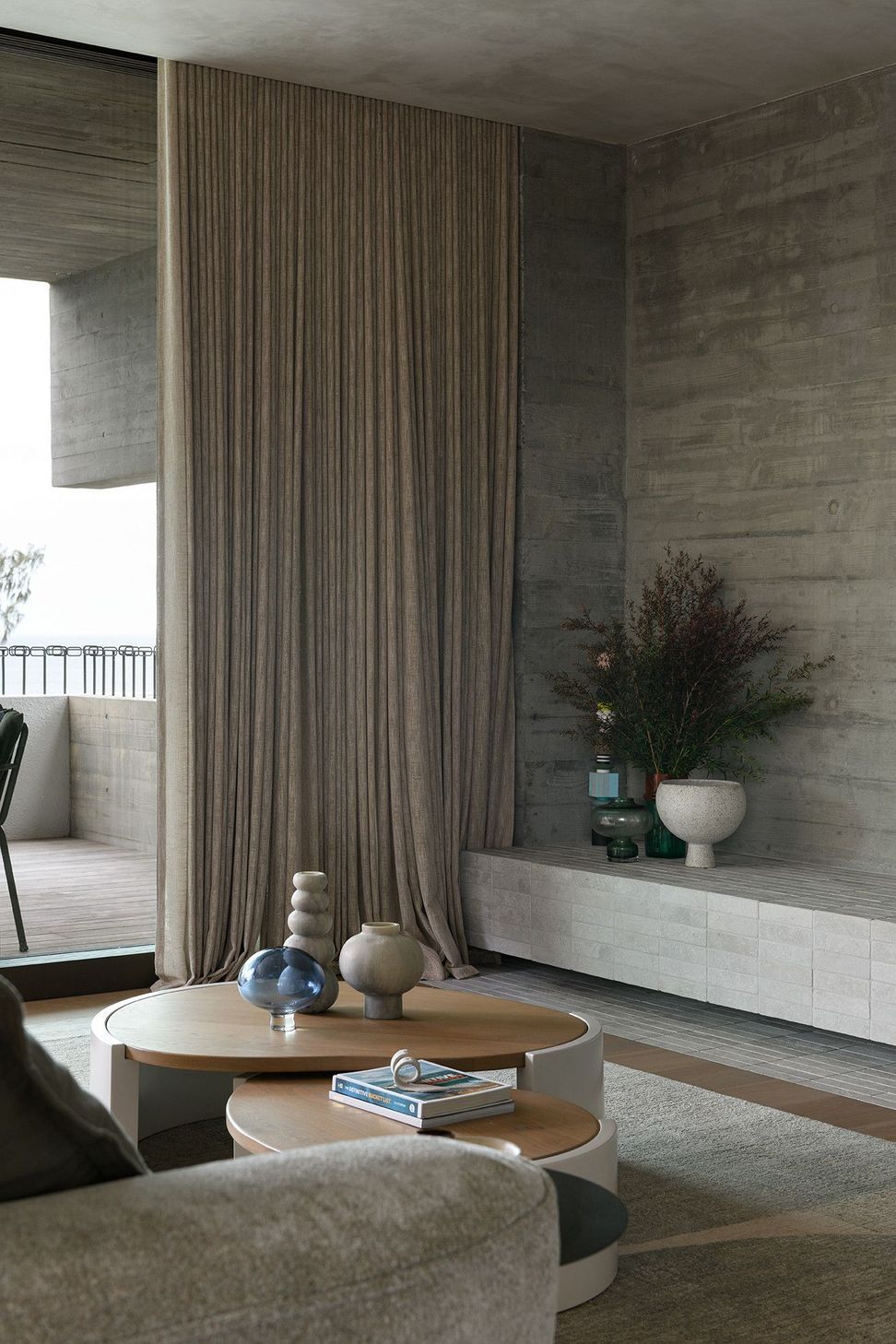 Villa Solare - Living Room. Living area with sheer curtains and a low coffee table.