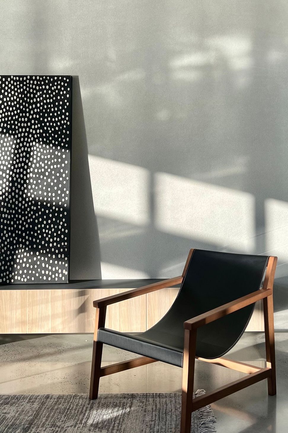 Bells Esplanade - Living Room. Perforated screen casting patterned light.