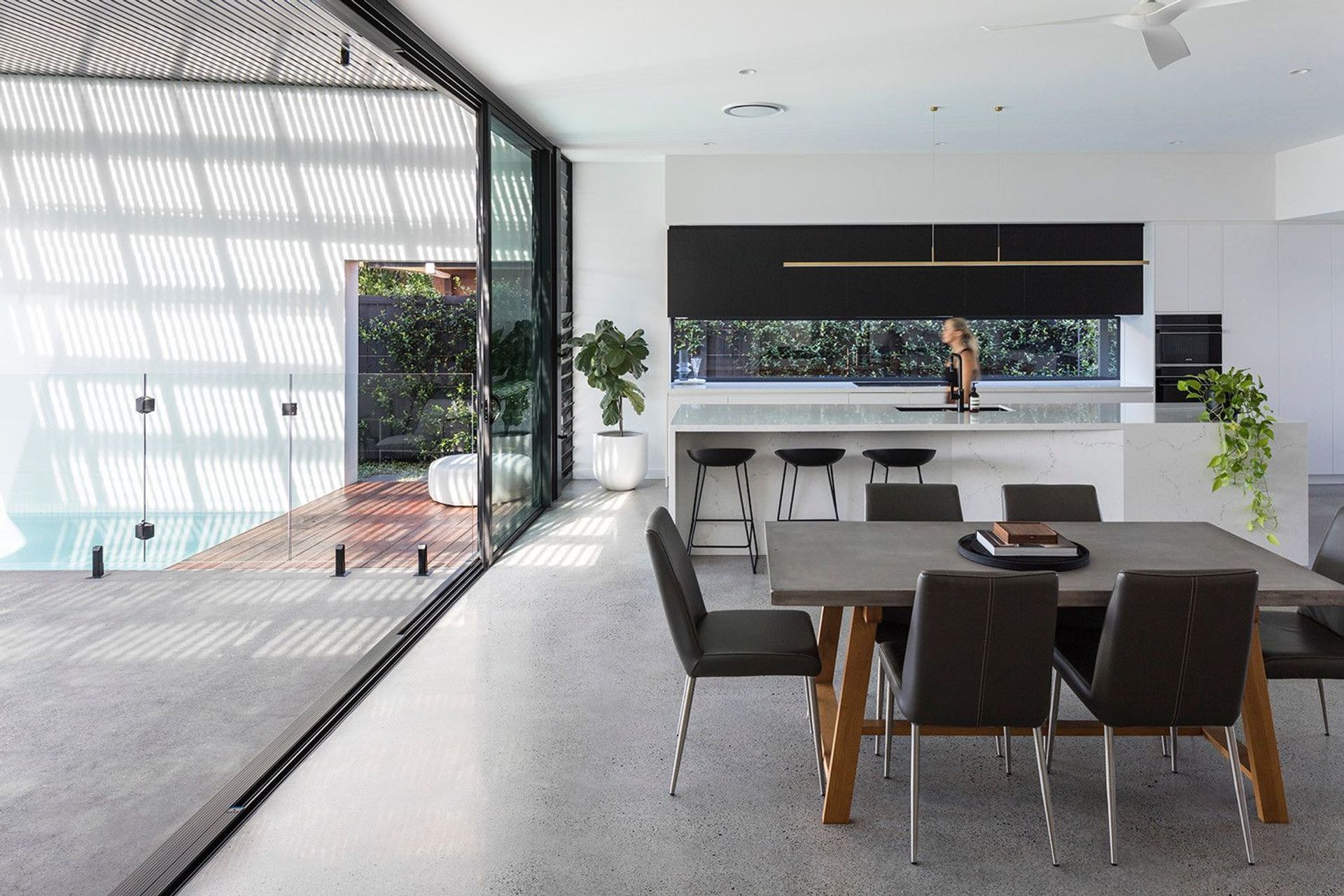 Morrison Residence - Dining Room. Dining table opening to the outdoor living area.