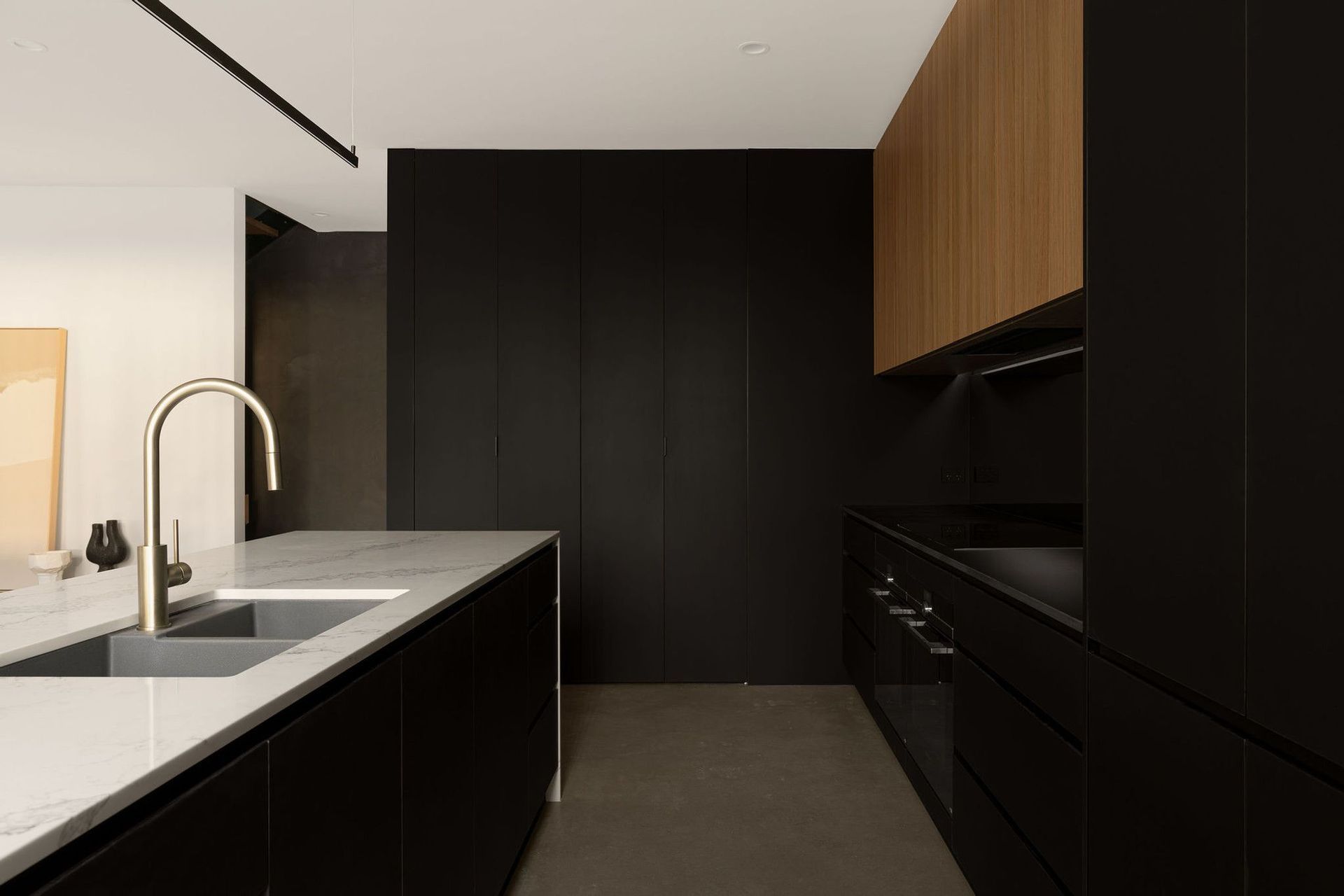The Smith - Kitchen. Black joinery and timber cabinetry in the kitchen.