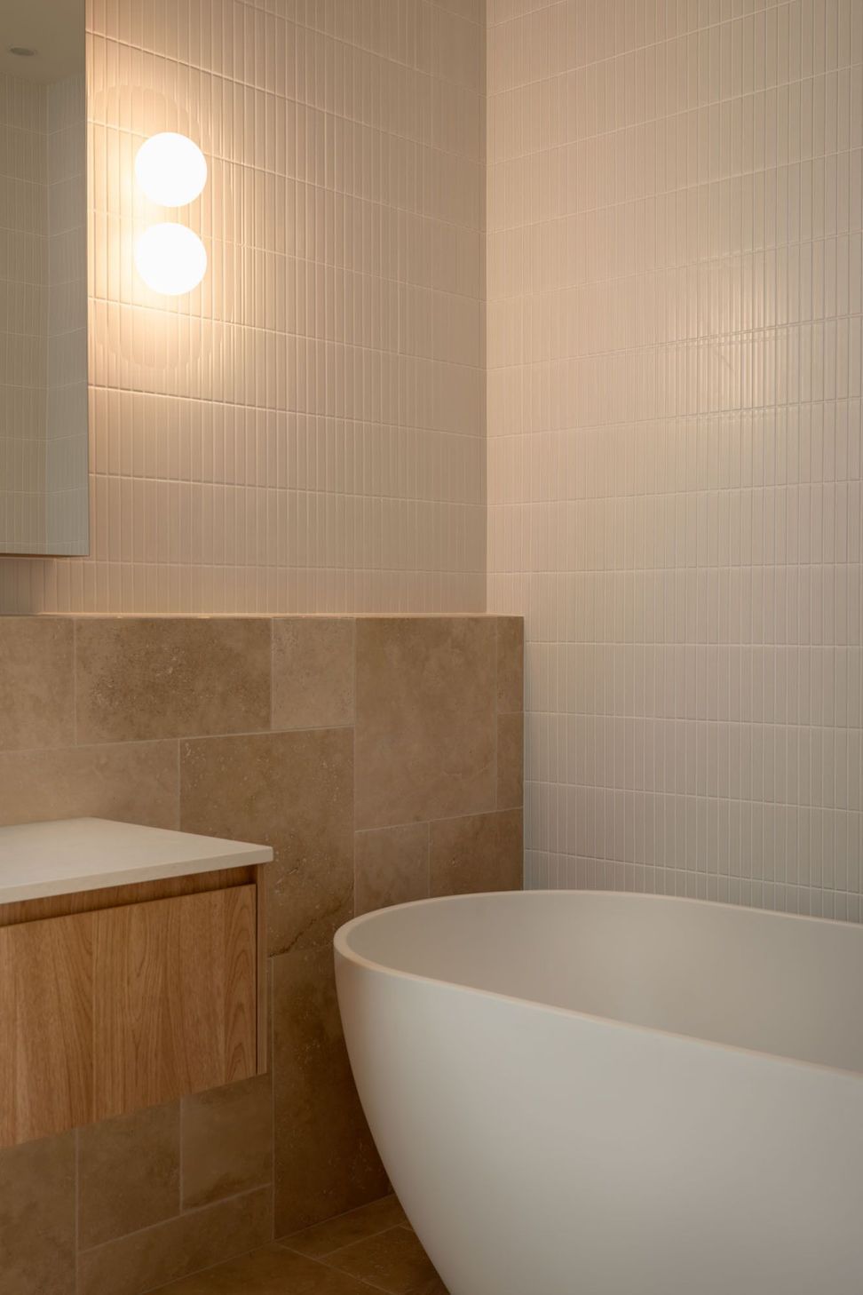 Warrego - Bathroom. Travertine tiles and vanity in soft warm tones.