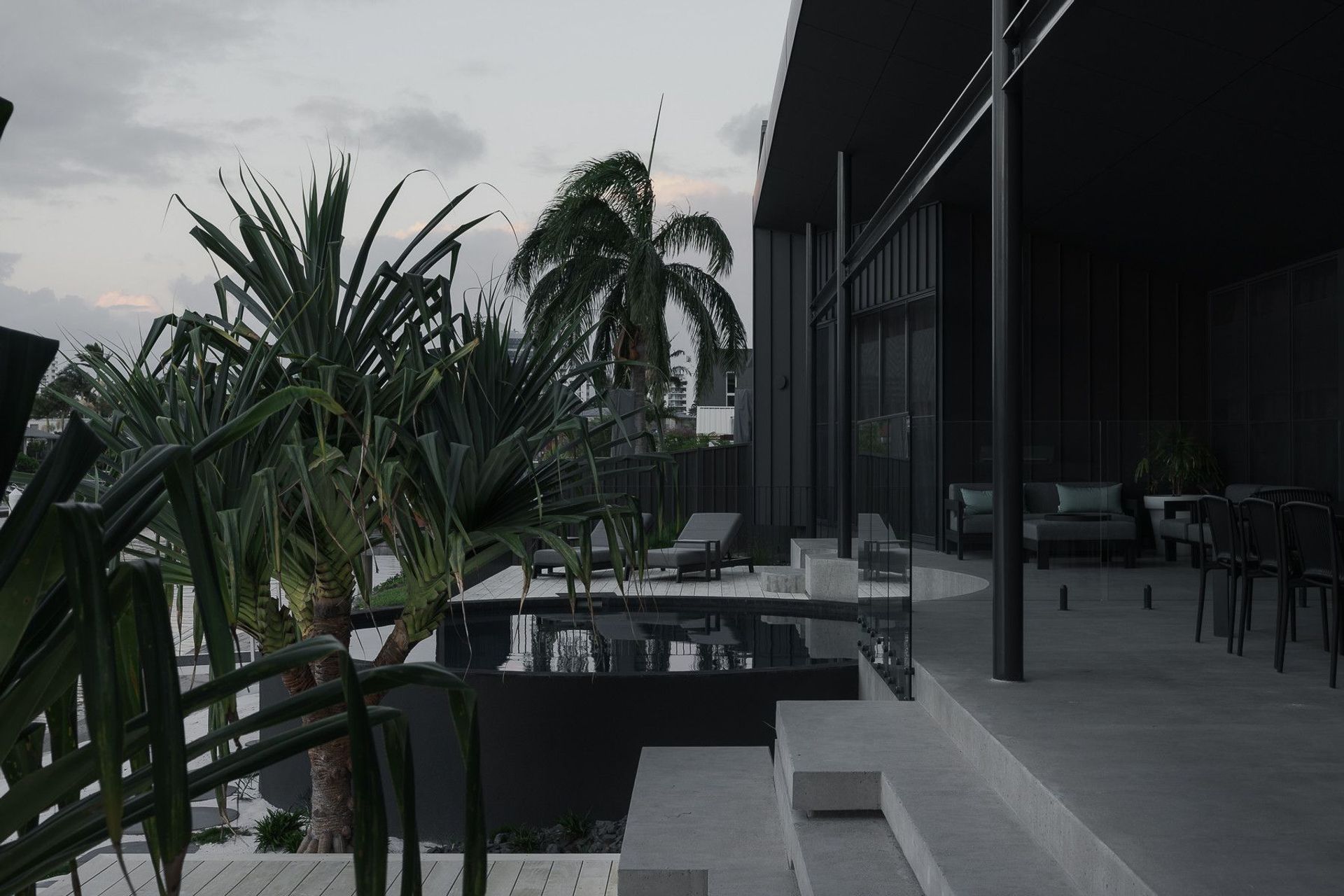0042 Residence - Patio. Terrace looking out over palms and the canal.