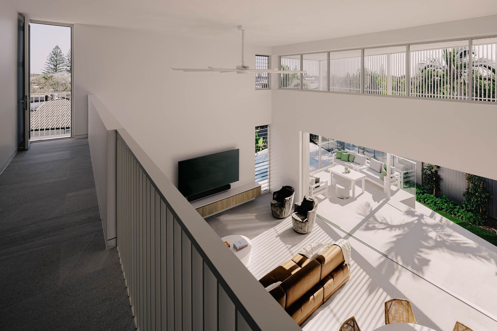 Zaremba Residence - Living Room. Living area seen from above with timber cabinetry.
