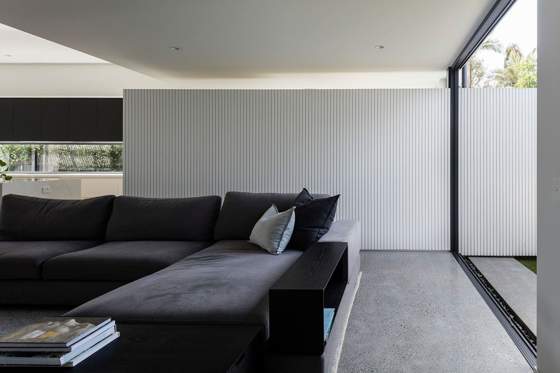 Morrison Residence - Patio. Covered outdoor lounge with a charcoal modular sofa.