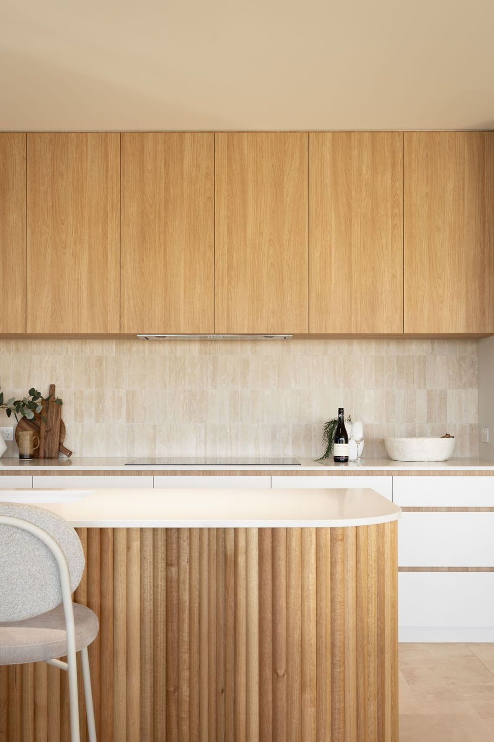 Warrego - Kitchen. Timber cabinetry above a fluted island bench.