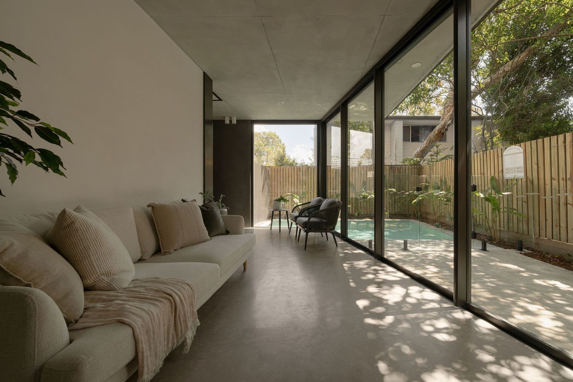The Smith - Living Room. Living area opening to the courtyard pool.