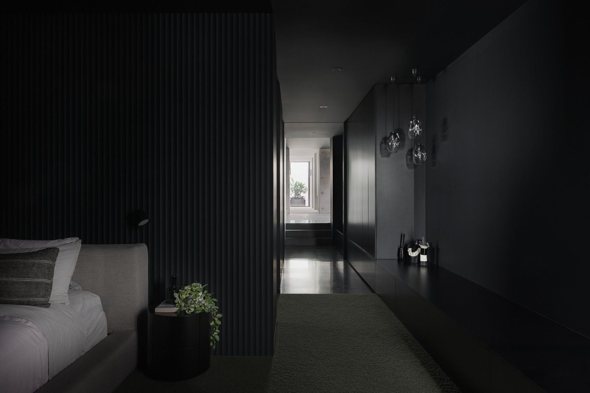 0042 Residence - Hall. Dark battened hallway with sculptural wall lights.