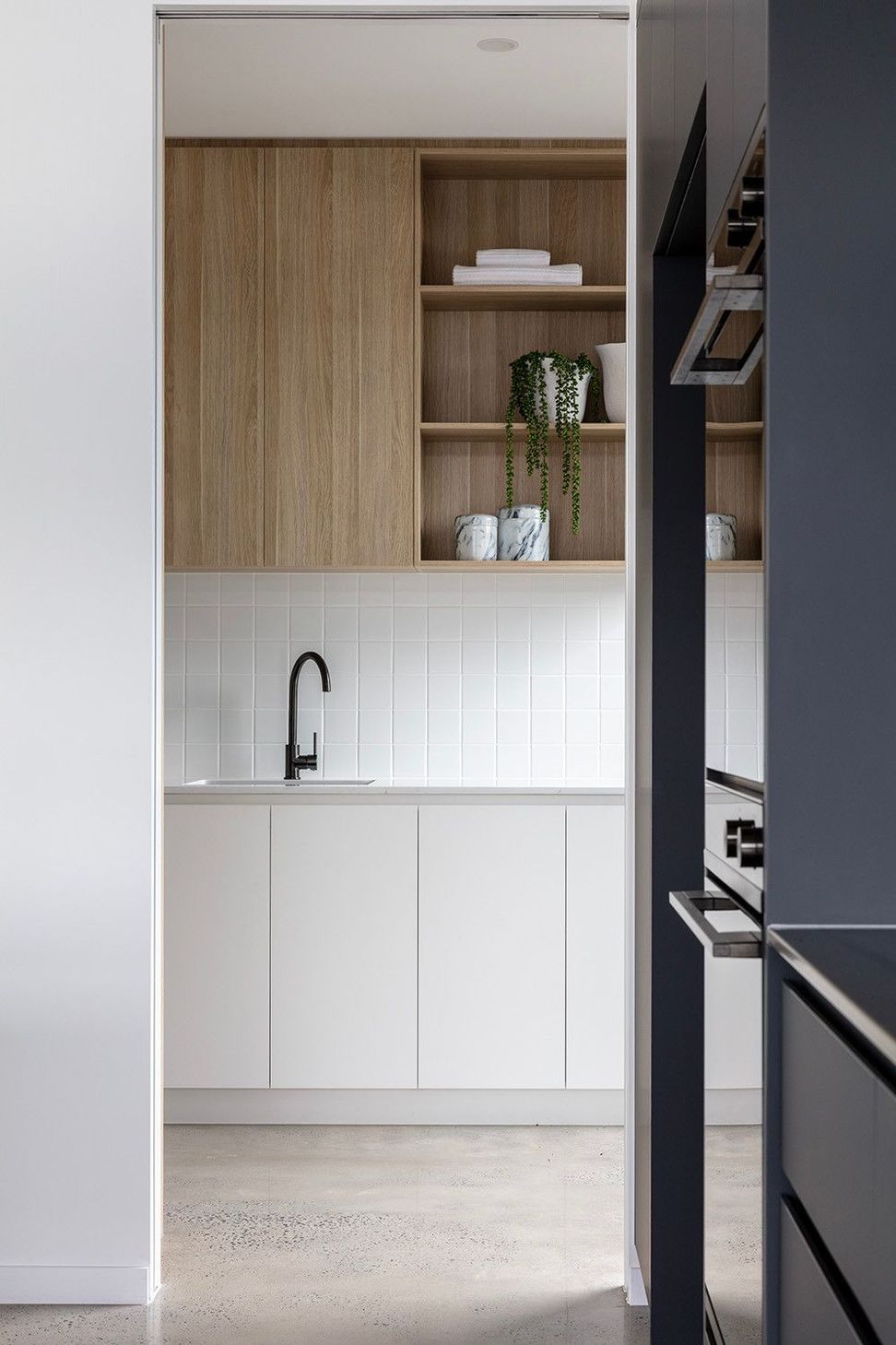 Bells Esplanade - Kitchen. Timber shelving above the scullery bench.