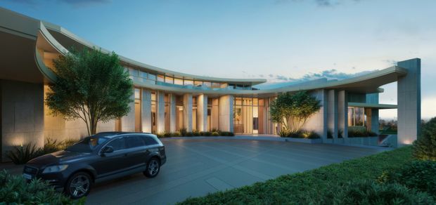 A wide exterior architectural view of a large, low-slung contemporary residence or institutional-style building arranged around a broad paved forecourt. The building features sweeping curved rooflines, extensive floor-to-ceiling glazing, slender vertical columns, warm timber-toned window frames, and strong horizontal cantilevered forms. Landscaped planting and a parked car appear in the foreground, with a blue evening sky behind.