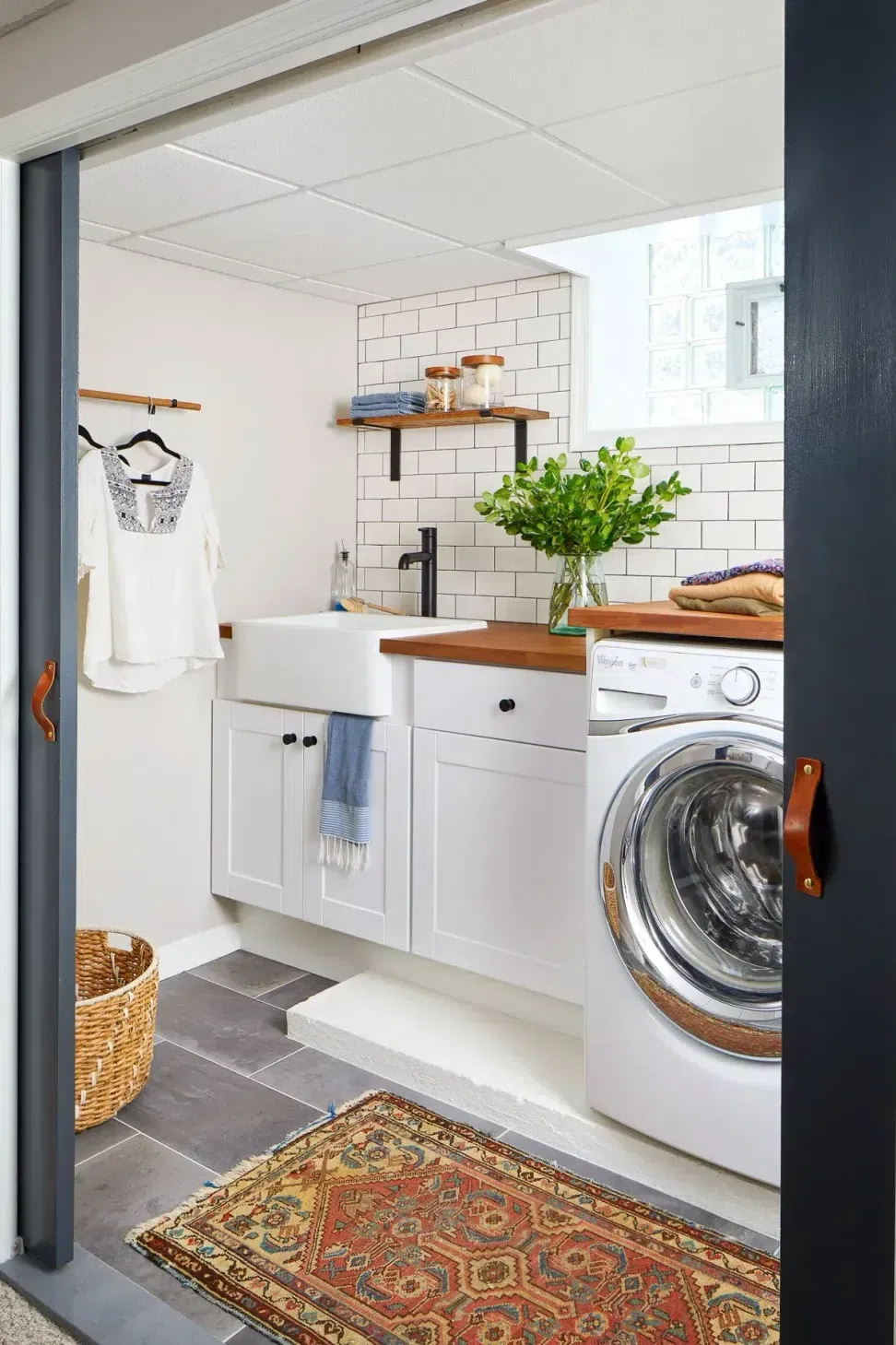 sharp-and-grey-interiors-laundry-room-renovation-subway-tile-farmhouse-sink-philadelphia-pa.webp