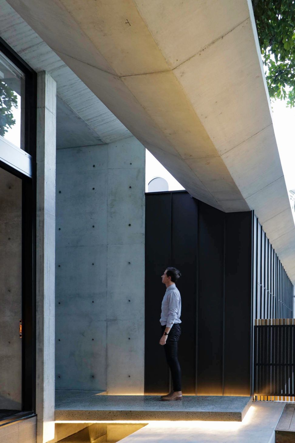 McGovern Residence - Hall. Off-form concrete walls with a slot of sky above.