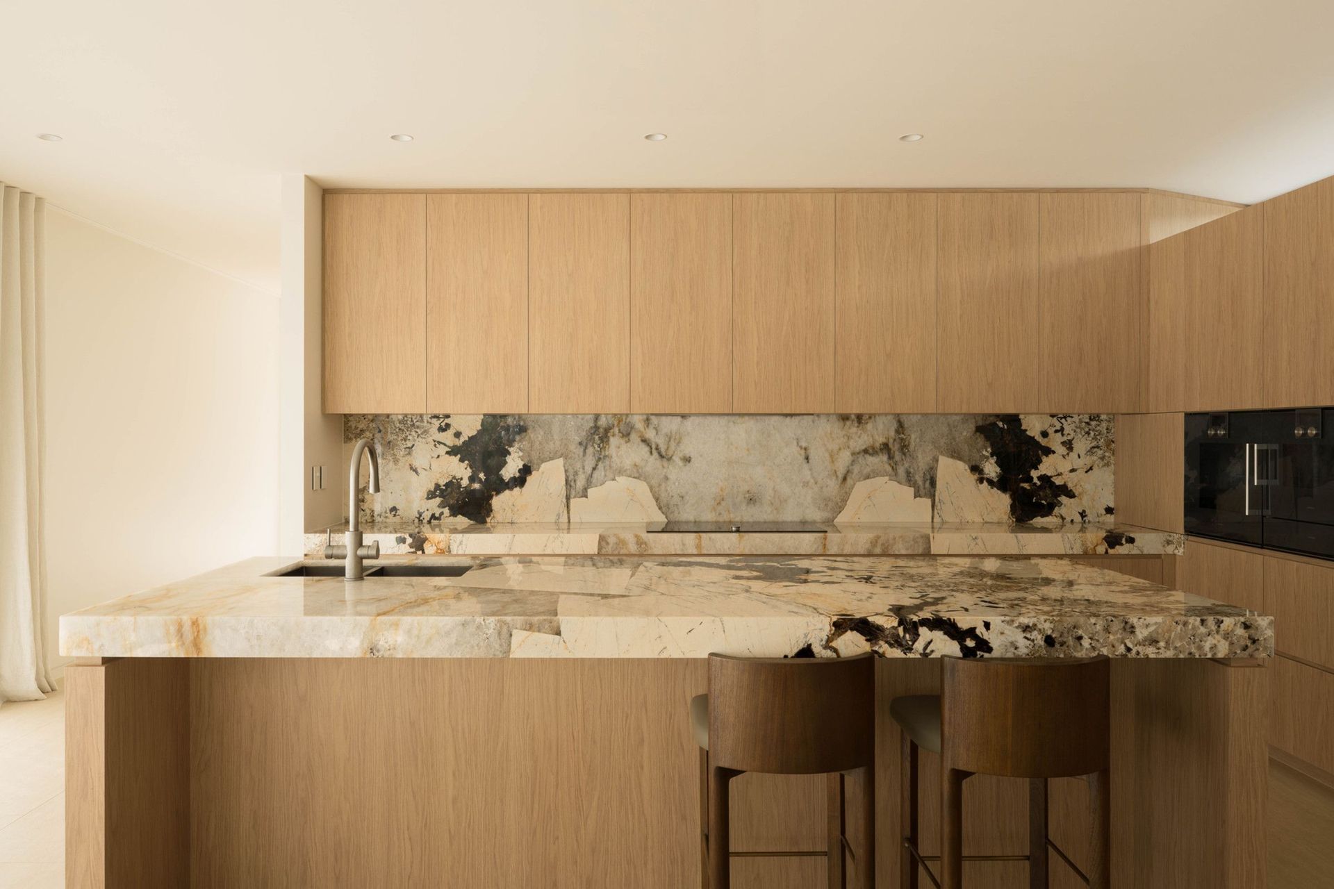 Henderson - Kitchen. Kitchen with a dramatic marble splashback set in warm timber.