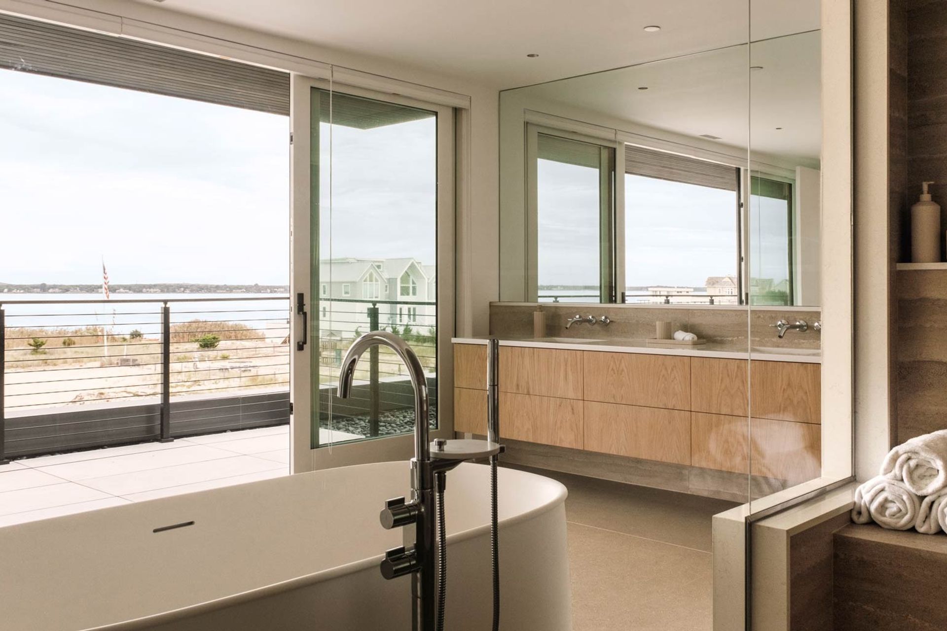 imgi12luxury-spalike-modern-bathroom-with-hampton-bay-views-and-floating-tub.jpg