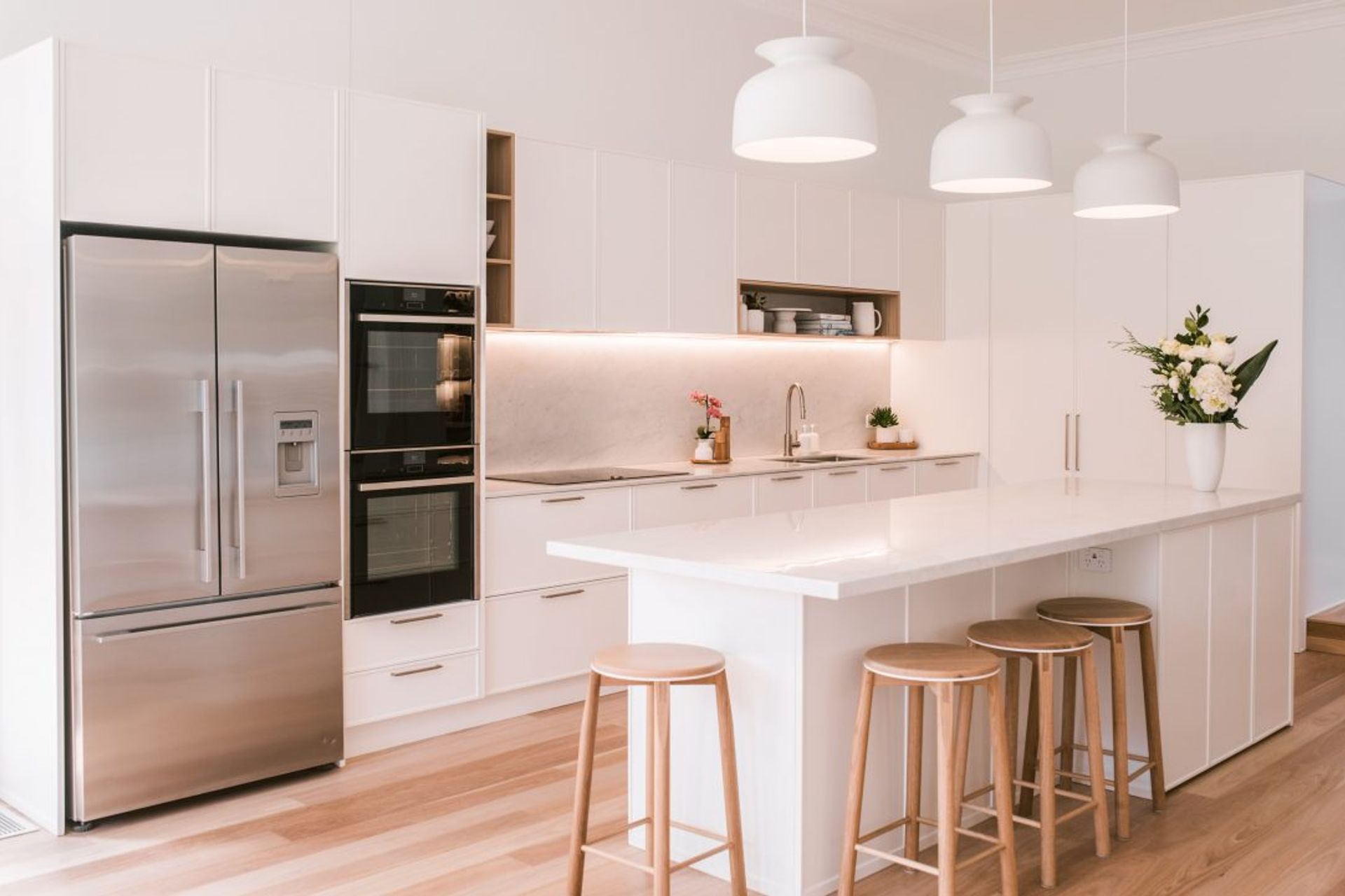 kitchen-design-sydney-luxury-kitchen-white-stone-bench-timber-floor-ornate-doors-02-1084x721.jpg
