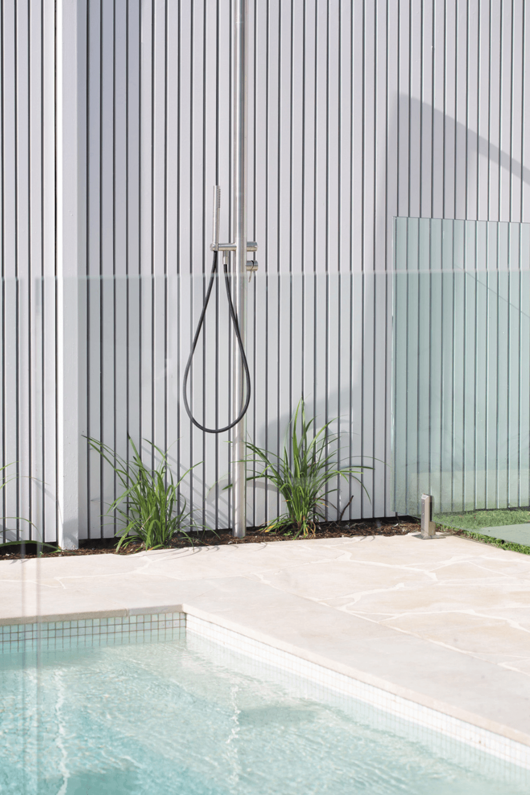 Cathedral Crazy Paving poolside. Natural variation that softens every edge.