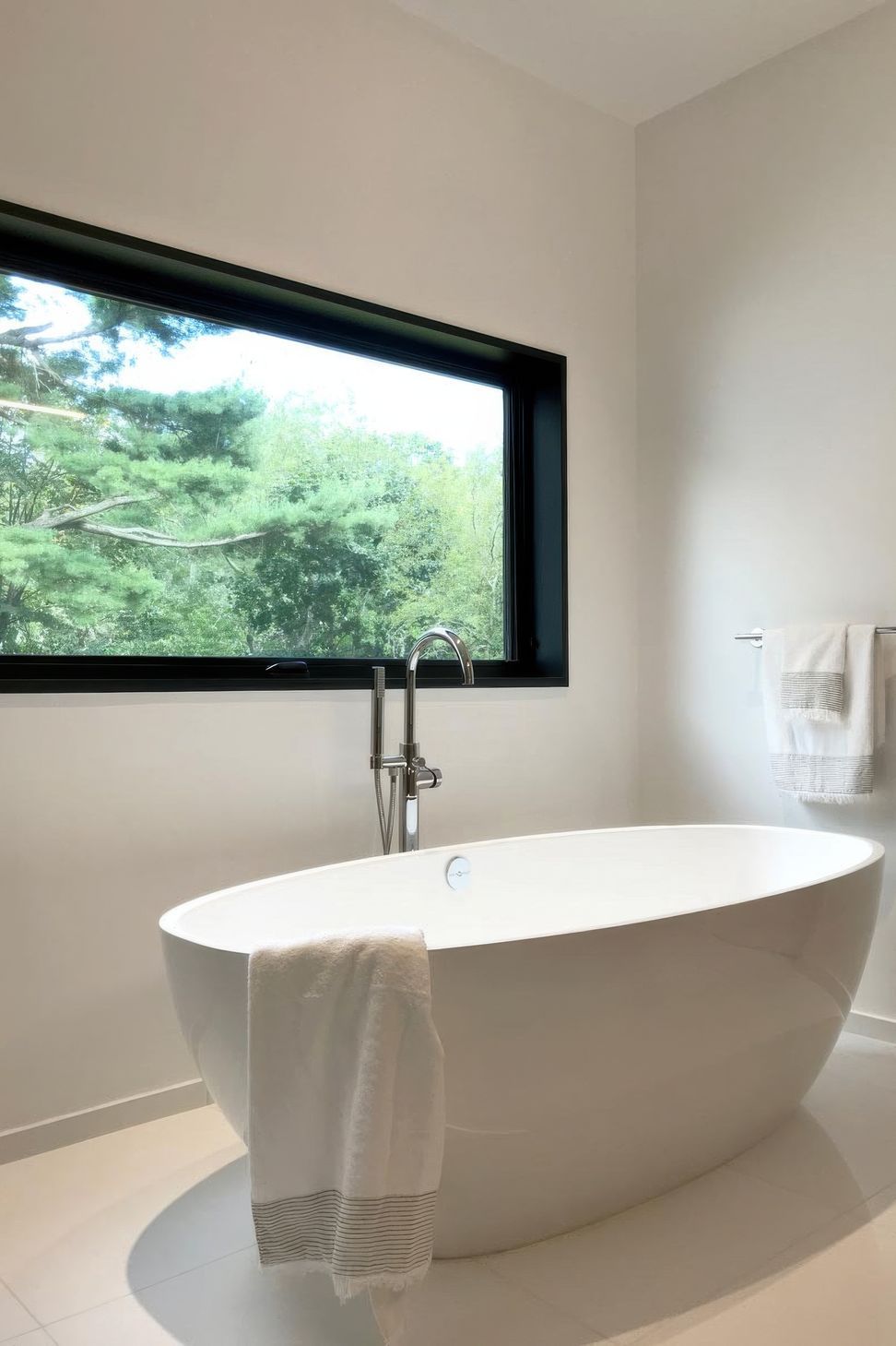imgi18minimal-white-bathrooom-freestanding-tub-scenic-new-york-views-gigapixel-standard-v2-2x.jpg