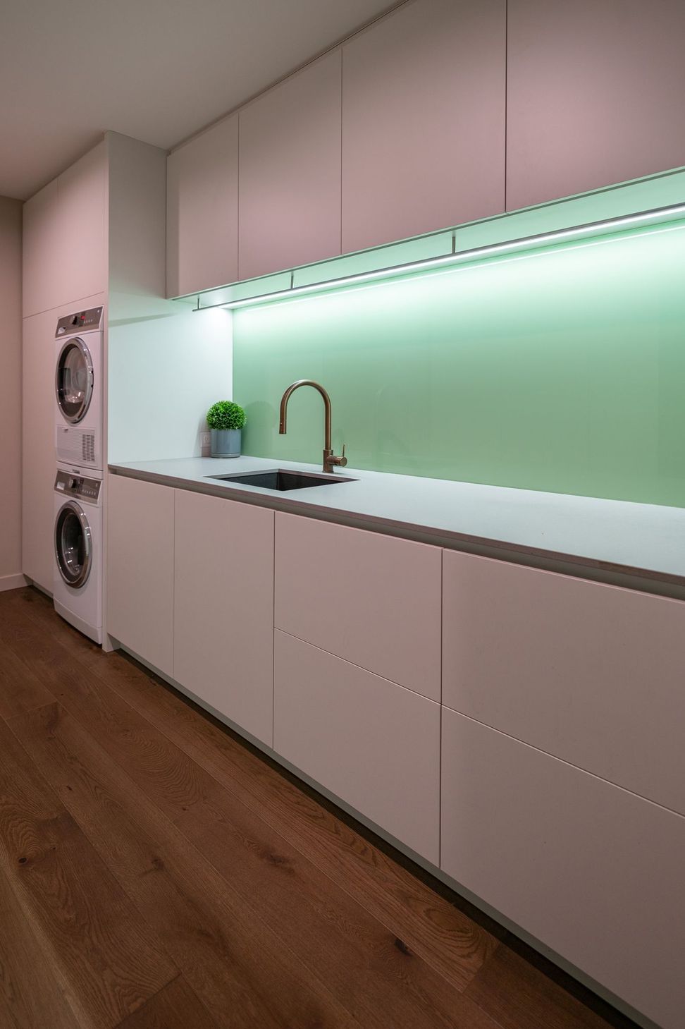 The laundry/utilities room is tucked downstairs behind the garage.