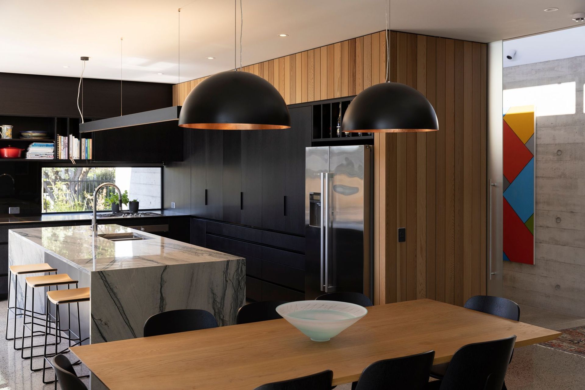 The client requested a black kitchen, says Richard, and they sourced their own stone for the benchtop. The tapware is by Dornbracht and the sink is Burns &amp; Ferrall.