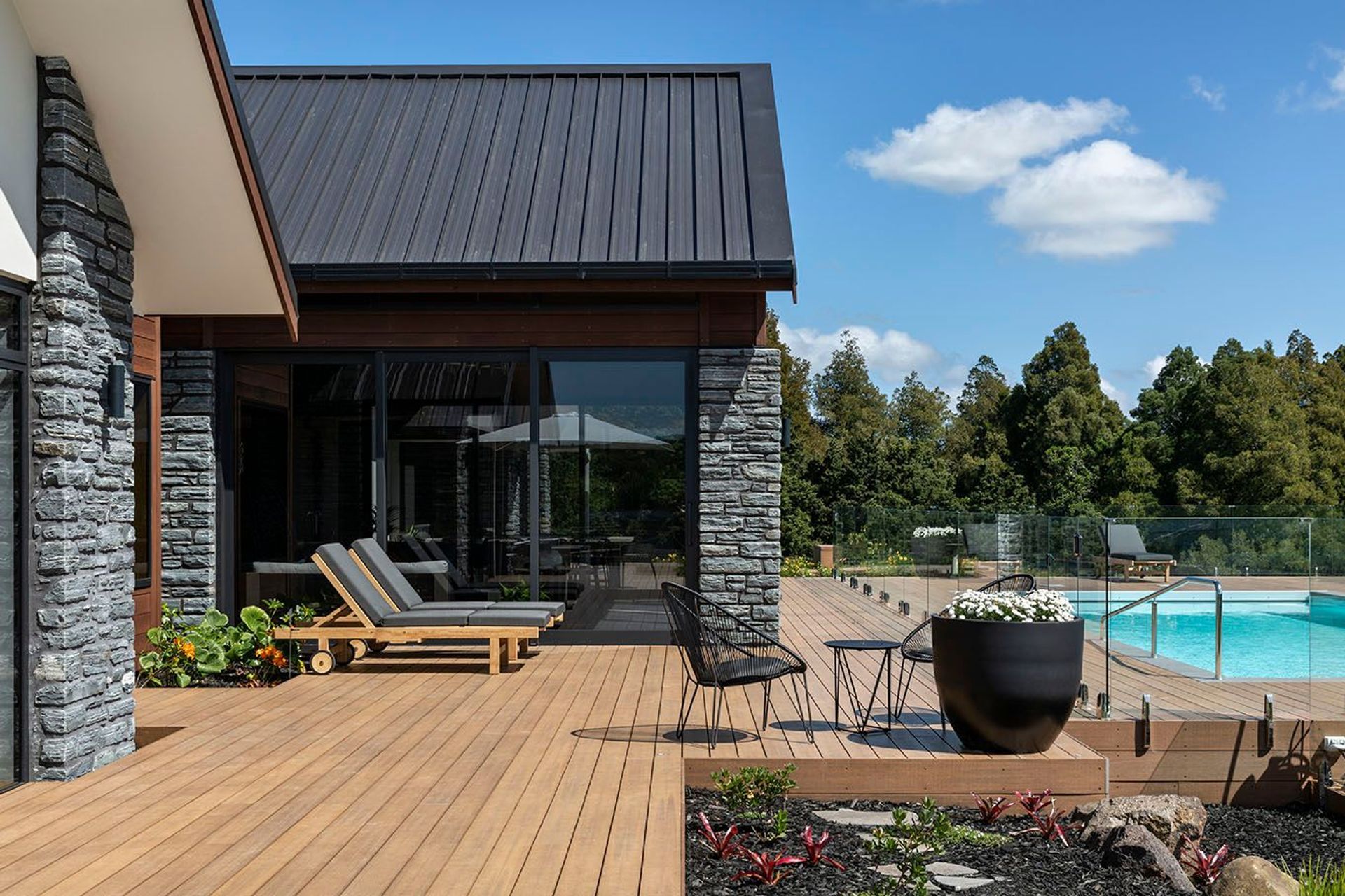 Living areas open out view extensive decks to the pool.