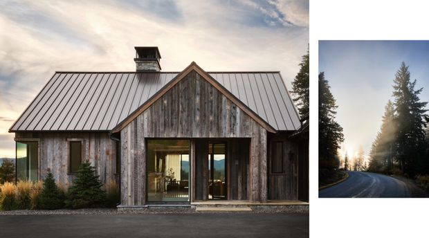 Exterior view of a compact rustic-modern house with weathered timber cladding, a steep gabled central entrance, and a standing-seam metal roof. Large glazed doors open toward a wooded landscape, while a smaller inset image shows a forest road and tall conifers. The building has a simple single-storey form with a small roof vent or chimney structure.