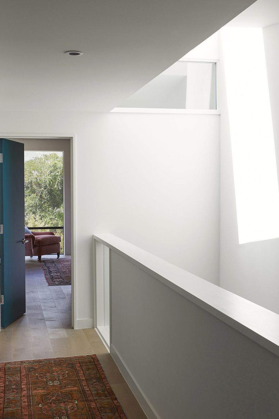 16ForestParkCuppettKilpatrickArchitectureandInteriorDesignaustin-tx-bright-hallway-skylight-stair-primary-bedroom.jpg
