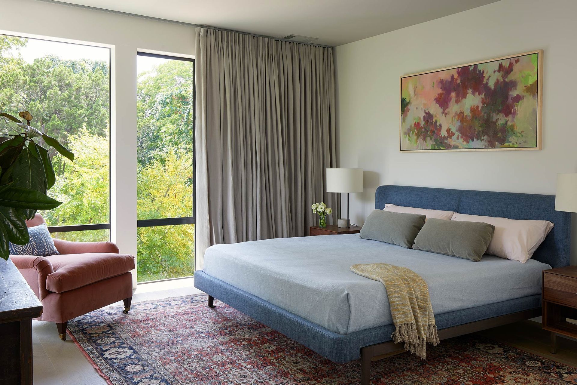17ForestParkCuppettKilpatrickArchitectureandInteriorDesignaustin-tx-primary-bedroom-blue-headboard-oriental-rug.jpg
