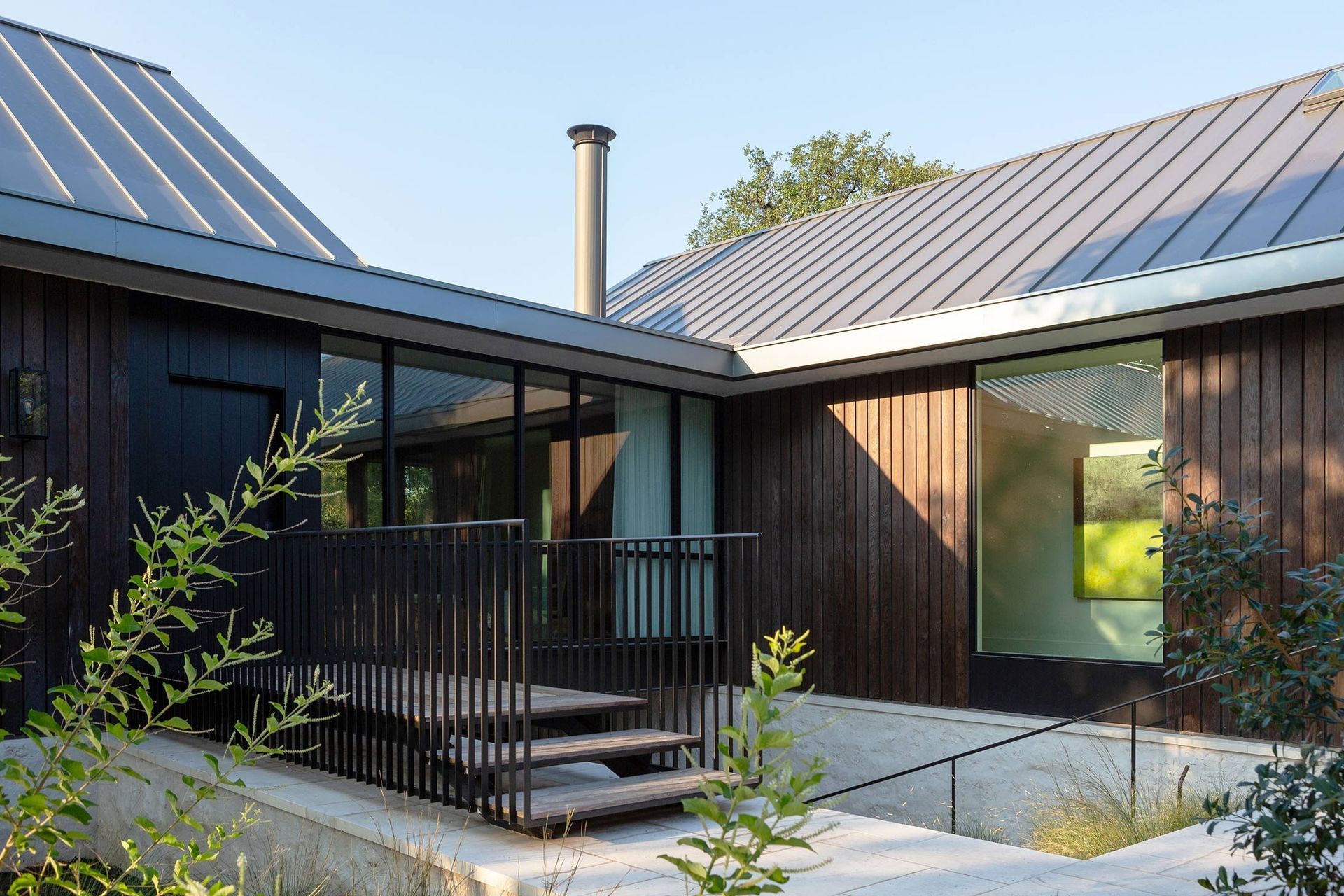 5BelmontParkCuppettKilpatrickArchitectureandInteriorDesignaustin-tx-modern-entryway-elevated-walkway-weathered-wood-siding.jpg