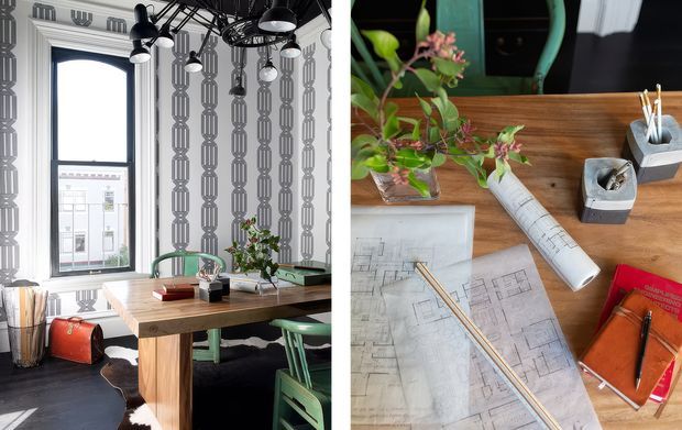 A stylish home office shown in a split composition: the left side features a timber desk, green metal chairs, patterned wallpaper, a tall window, pendant lighting, plants, and a cowhide rug; the right side provides an overhead view of architectural drawings, pencils, notebooks, stationery, and a small plant on a timber work surface.