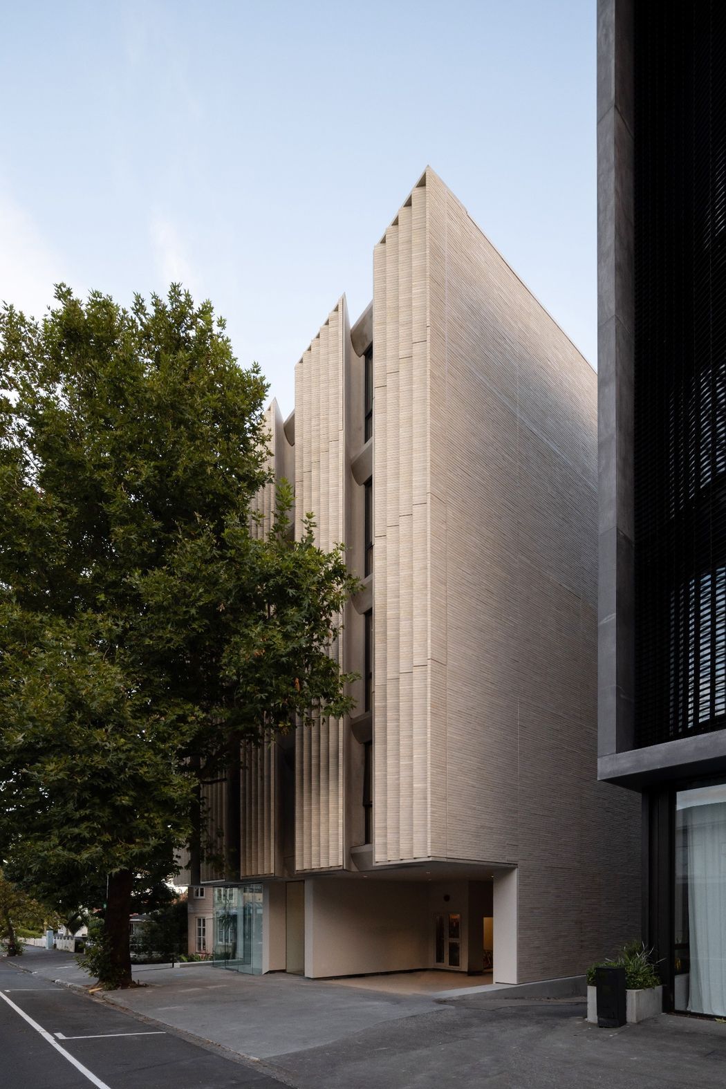 Designed-by-Monk-Mackenzie-for-Artifact-Property-Jervois-Road-uses-Eco-Outdoor-Daly-Stone-Bricks-to-create-a-finely-articulated-facade-that-balances-urban-density-with-domes-v2.jpg