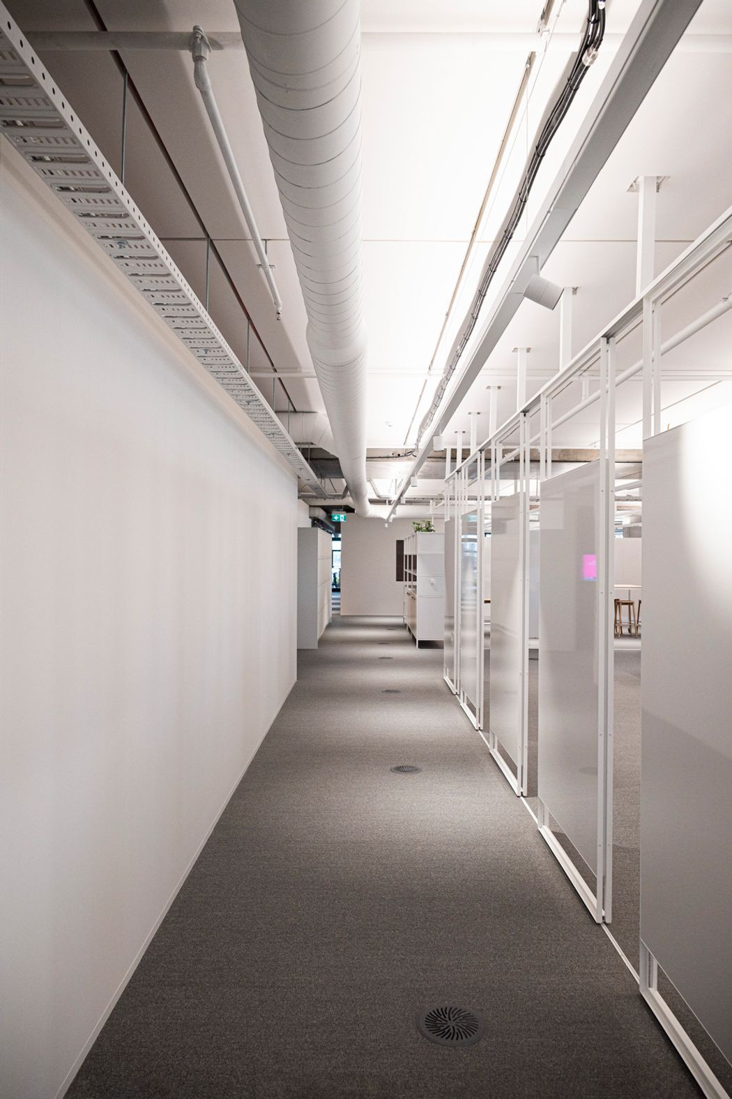 A sliding track allows these whiteboards to move and transform spaces. Studco engineering ensured that open plan spaces such as this office floor were feasible.