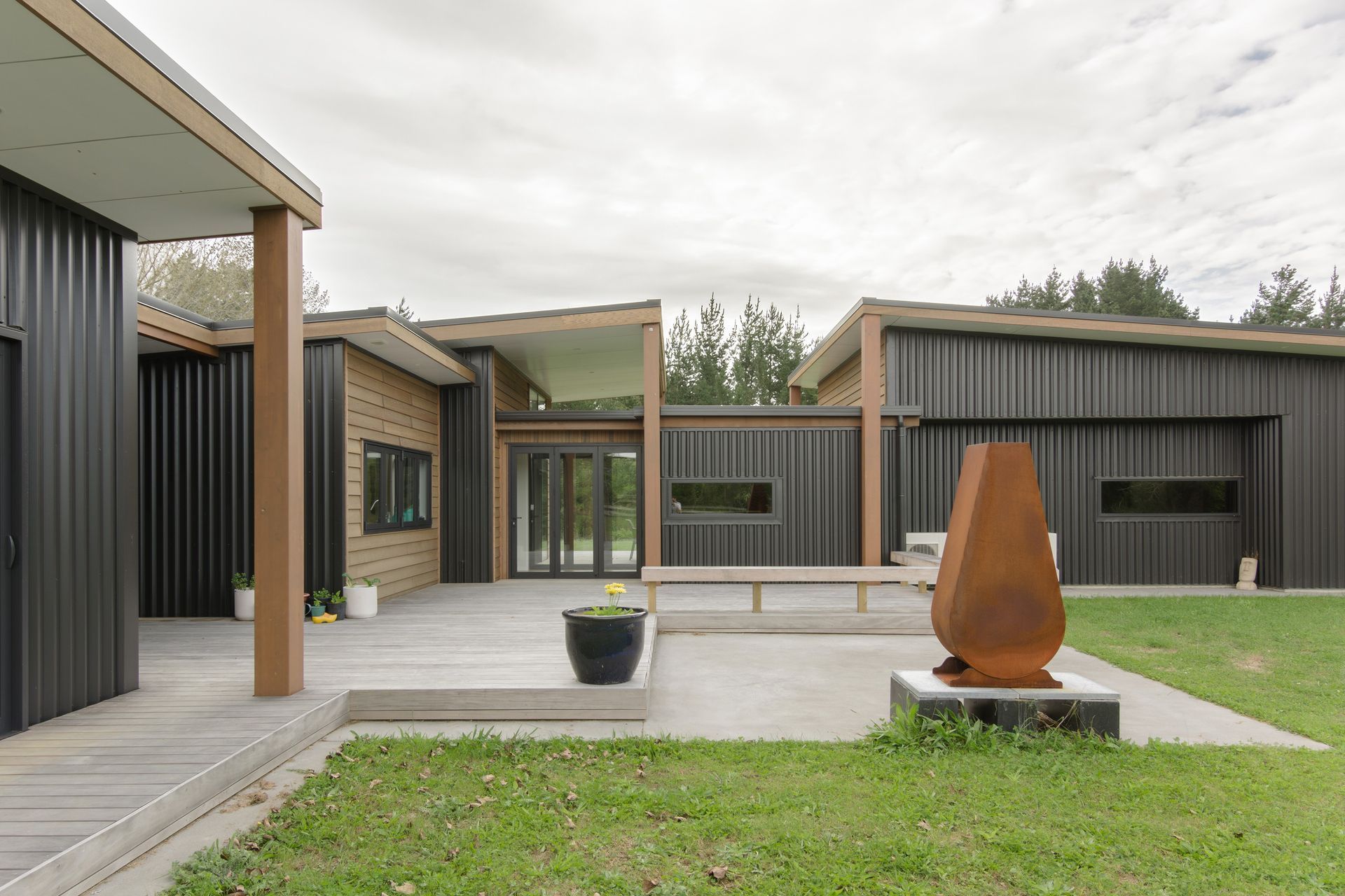 Sheltered decks for outdoor living on multiple sides of the home, this one with easy access off the kitchen