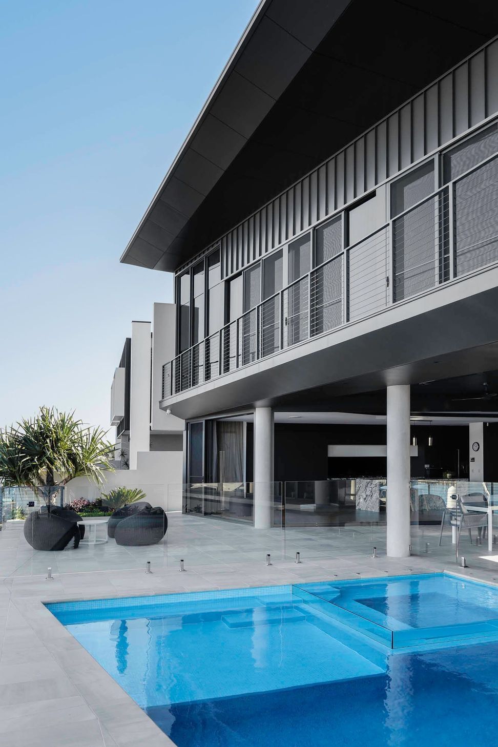 Robbie Residence - Exterior. Canal elevation with deep balconies and covered terraces.