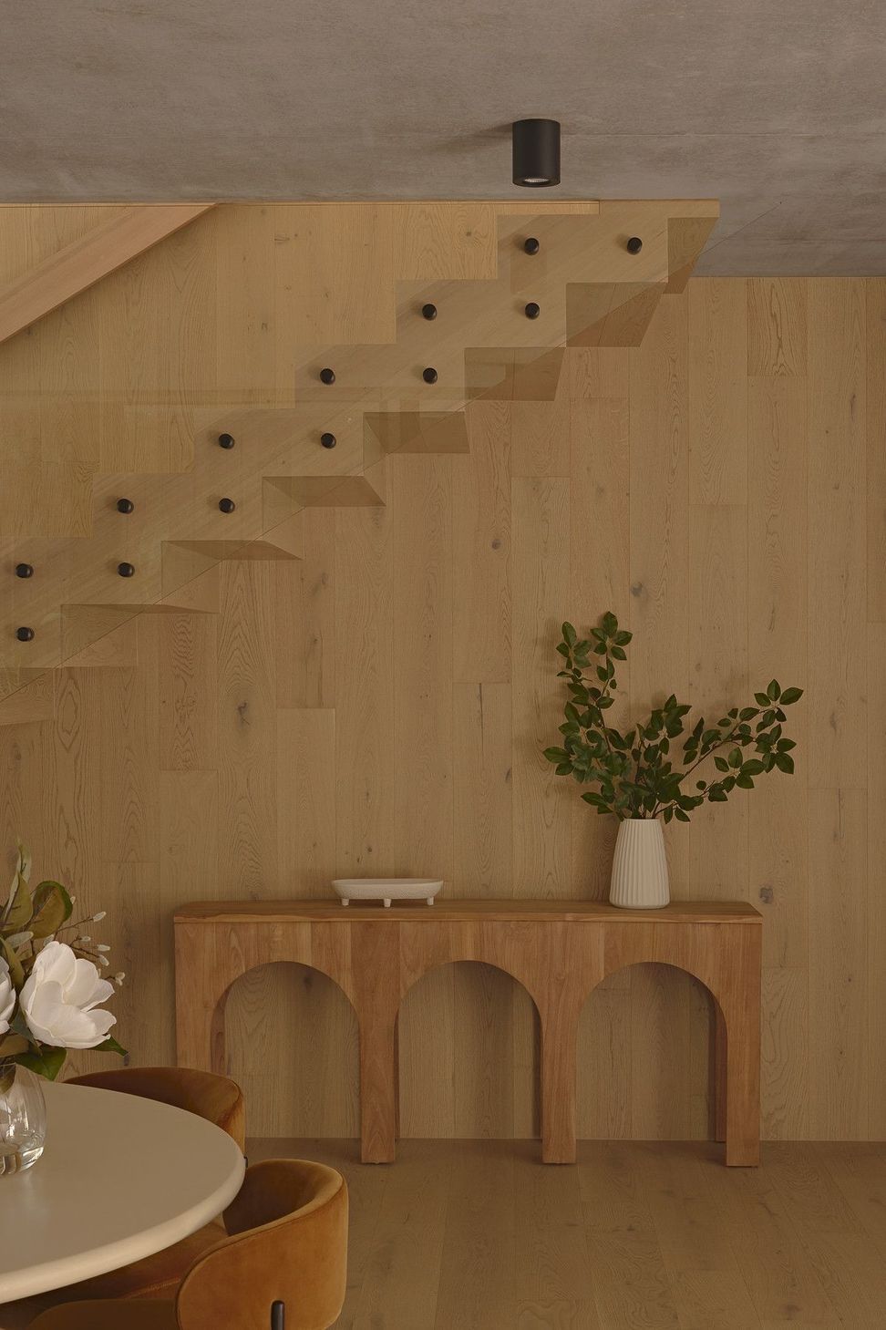 Wildflower Residence - Staircase. Floating timber stair above an arched console.