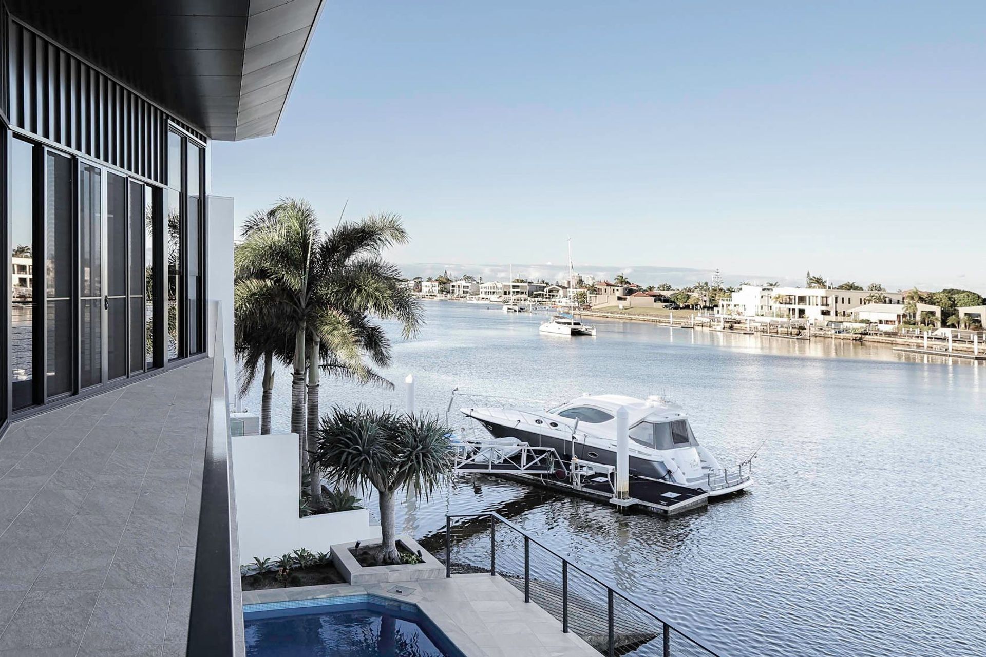 Robbie Residence - Exterior. View across the canal to moored boats.