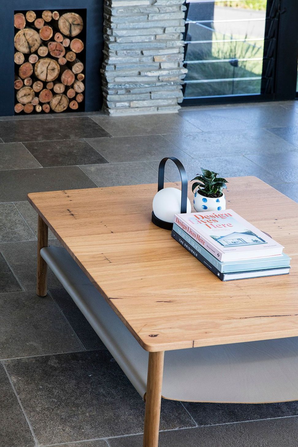 Clark Residence - Living Room. Timber coffee table on a stone floor.