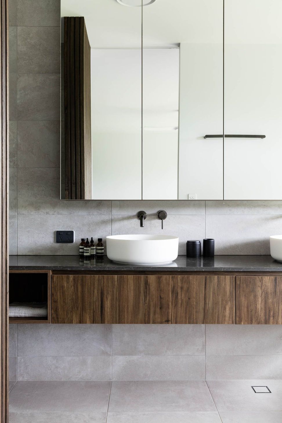 Watson Residence - Bathroom. Vessel basin and wall tapware on a timber vanity.